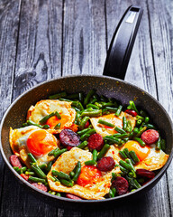 Breakfast of green beans baked eggs and chorizo