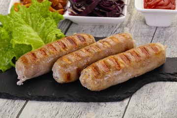 Grilled sausages served mushrooms and cabbage