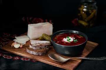 Traditional ukrainian cuisine. Bowl with tasty red borscht soup.