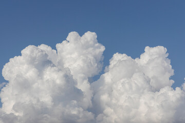 Naklejka na ściany i meble fluffy clouds and blue sky background
