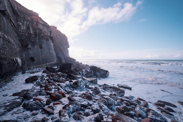 Fototapeta na wymiar Atlantic ocean beach on the rock coast. Portugal.