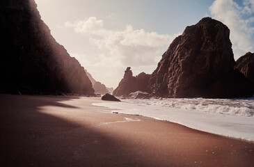 Atlantic ocean beach with cliffs and rocks. Praia da Ursa, Portugal.