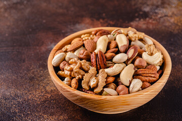 Various Nuts in wooden bowl.