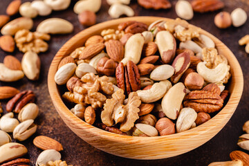 Various Nuts in wooden bowl.