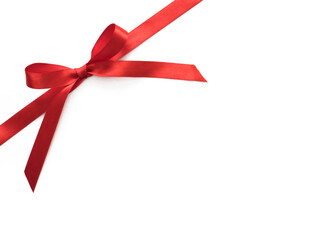Shiny red satin ribbon bow isolated on white with copy space for your text.