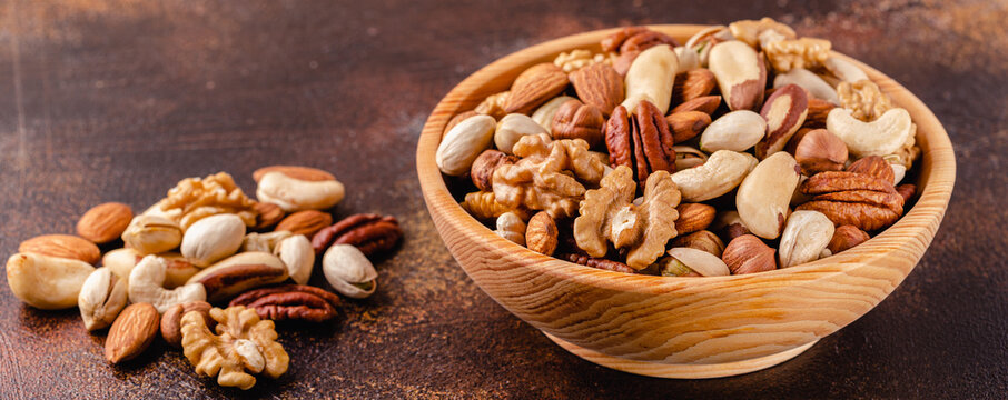 Various Nuts in wooden bowl.