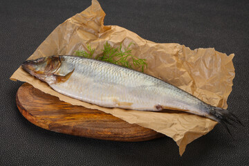 Salted herring over the wooden board