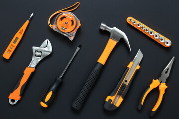 Set of tools on black background. Construction, DIY concept. Equipment,  workplace. Flat lay...