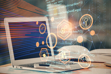 Double exposure of table with computer on background and data theme hologram. Data technology concept.