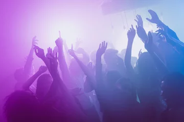 Foto op Plexiglas Photo of big company many people funny raise arms dance floor neon bright pink spotlight modern club indoors © deagreez