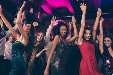 Photo portrait of wild crowd dancing together with hands in air at nightclub wearing beautiful...