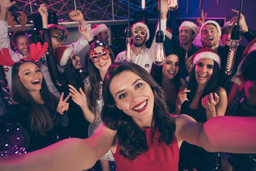 Photo of positive funny people shoot selfie girl show v-sign have fun enjoy dance floor modern club indoors