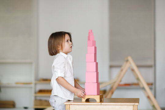 Child Girl Playing With Pink Tower, Developing Sensory Activities In Montessori And Earlier Child Development, Kids Independence