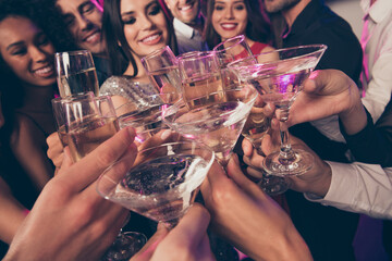 Close-up photo portrait of clinking champagne cocktail glasses