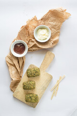 Broccoli nuggets on a white background