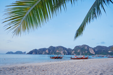 Travel by Thailand. Landscape with traditional longtail fishing boat on the sea beach.