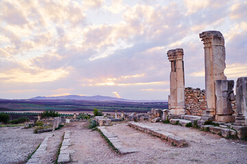 Beautiful sunset lanscape. The ancient antigue roman city Volubilis in Morocco, Africa.