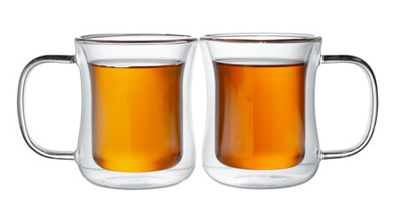 Two glass cups of tea isolated on white