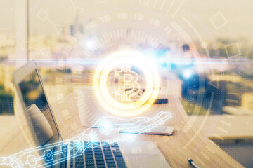 Double exposure of blockchain theme hologram and table with computer background. Concept of bitcoin crypto currency.