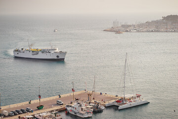 Big white ferry ship entering Adriatic harbor.