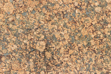 The texture of a variegated speckled polished marble slab.