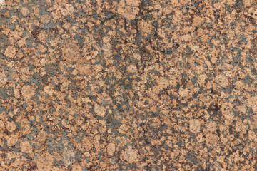 The texture of a variegated speckled polished marble slab.