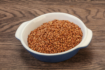 Raw buсkwheat cereal in the bowl