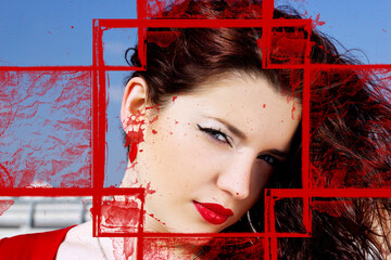 Portrait of a glamorous pretty girl with long red hair. A pretty woman posing on a background of a...