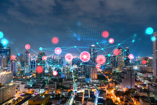 Abstract technology icons, night aerial panoramic cityscape of Bangkok, Asia. The concept of innovative approach to optimize international business process. Double exposure.
