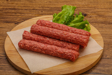 Raw beef sausages with spices