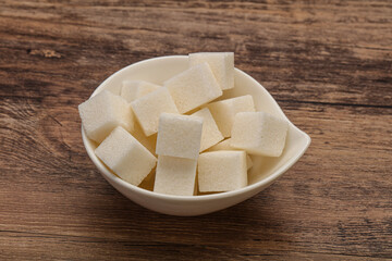 Refined white sugar cubs in the bowl