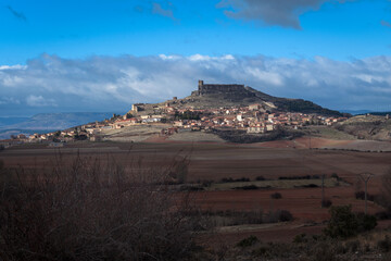 Landscape of the medieval village of Atienza with a cloudy blue sky, Guadalajara, Spain