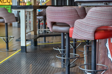 Empty purple soft chairs in the cafe. Selective focus.
