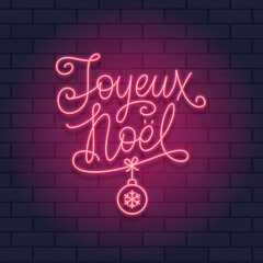 French Christmas red neon light sign on a brick wall dark background. Joyeux Noel calligraphic greeting design. Vector illustration. Joyeux Noel translation - Merry Christmas.