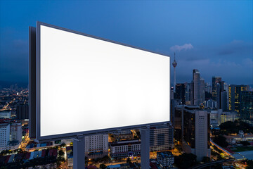 Blank white road billboard with KL cityscape background at night time. Street advertising poster, mock up, 3D rendering. Side view. The concept of marketing communication to promote or sell idea.