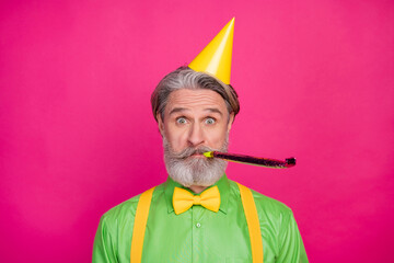 Photo of funny white haired grandpa blow noisemaker funky birthday party chilling wear paper cap...
