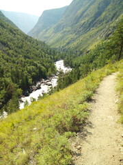 Road near the cliff and mountain river
