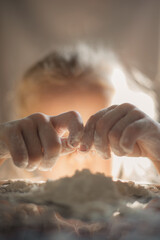 girl playing with flour. Close-up portrait of a girl playing with flour