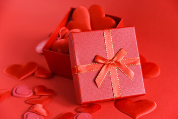 open heart-filled red gift box on red background. Love. Valentine's Day. Selective focus
