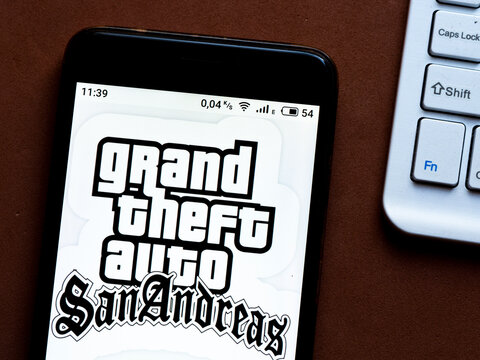 In this photo illustration a Grand Theft Auto: San Andreas appliance by Rockstar Games logo is seen displayed on a smartphone