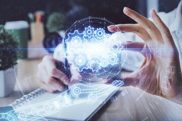 Multi exposure of writing hands on background with data solution hologram. Technology concept.