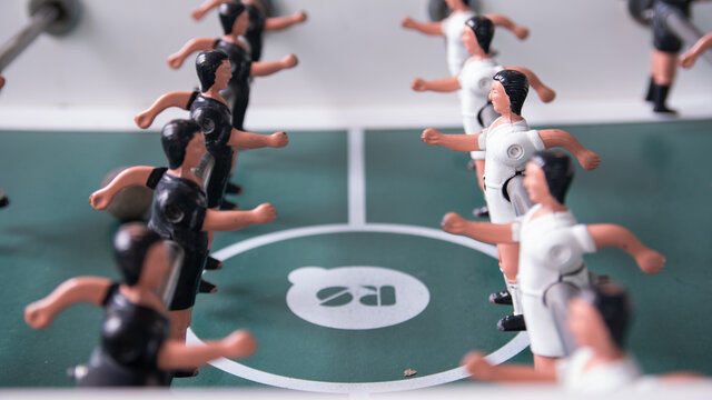 Top Down View Close-Up on Fooseball Table Players Facing Each Other