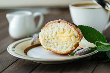 Cut donut with vanilla filling on a plate