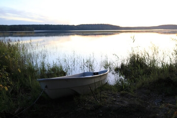 View of boat by lake in evening