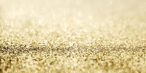 Fototapeta na wymiar Abstract gold glitter sparkle with bokeh background