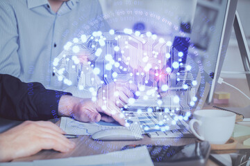 Man with computer background with brain theme hologram. Concept of brainstorm. Double exposure.