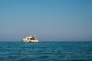 A large motorboat, in the Mediterranean sea, on a summers day
