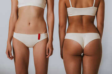 Two different girls in beautiful underwear, face and back