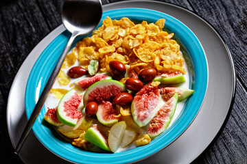 Healthy breakfast: yogurt, corn flakes, figs, pear