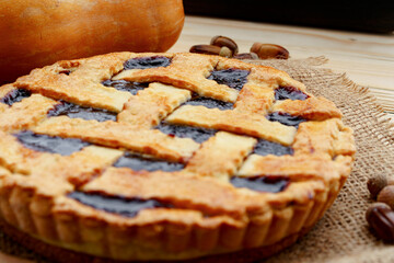 Close up of a berry tart pie on wooden table